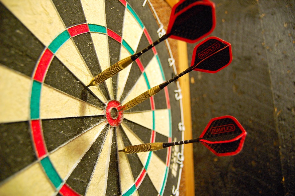 throwing darts at the board